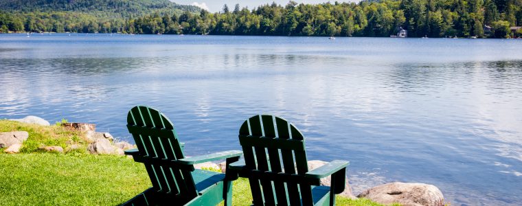 two chairs overlook a quiet lake encouraging government program managers to take a strategy offsite.