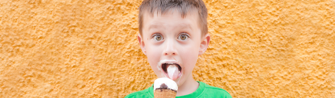 Boy licking an ice cream cone
