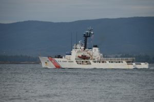 A white Coast Guard cutter on the Columbia River